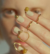 4 Nail rings in gold